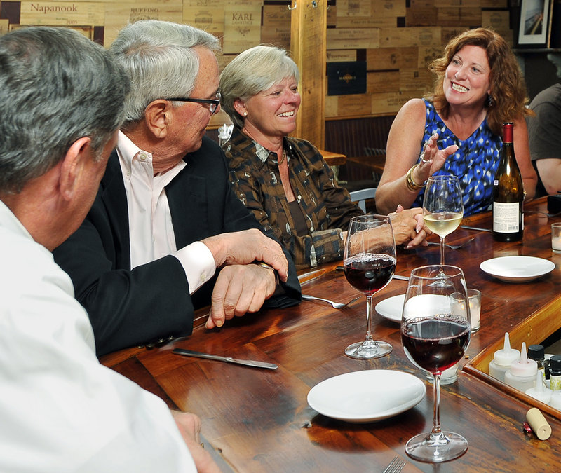 From left, Mal Davis, Dick and Carol Gaugh, and Michele Davis enjoy a good time at Old Vines Wine Bar.