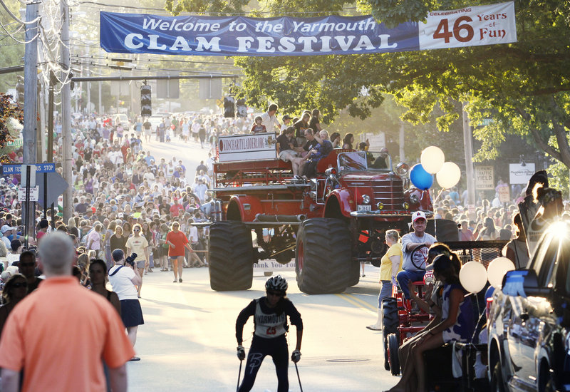One of the highlights of the Yarmouth Clam Festival parade, a “monster fire truck,” rolls through the procession kicking off the 46th annual event on Friday evening. The parade route was lined with spectators more than five deep in many places.