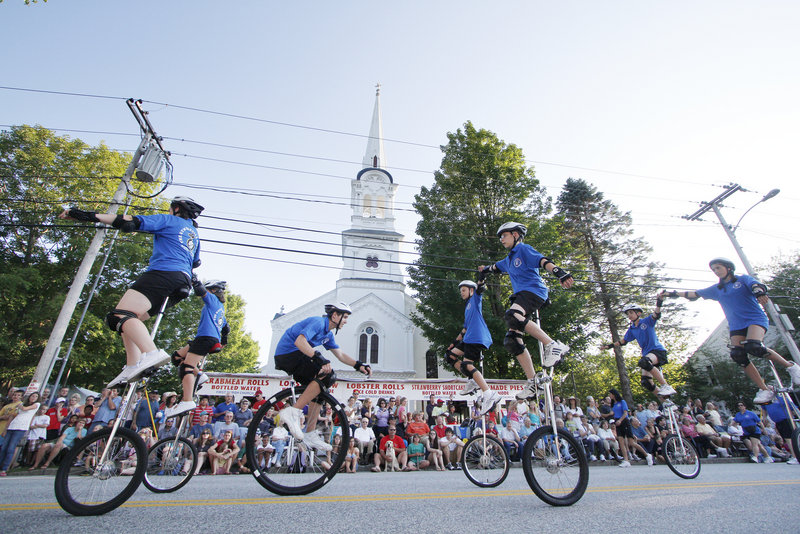 Members of the Gym Dandies of Scarborough ride along during the parade which kicked off the 46th annual Yarmouth Clam Festival on Friday evening. The festival continues with events scheduled today and Sunday.
