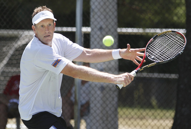 Brian Mavor of Yarmouth hits a return against Brian Powell of Kennebunkport during their men s semifinal Sunday at the 22nd Betty Blakeman Memorial tennis tournament in Yarmouth. Powell won 6-1, 3-6, 6-1 to reach the final.