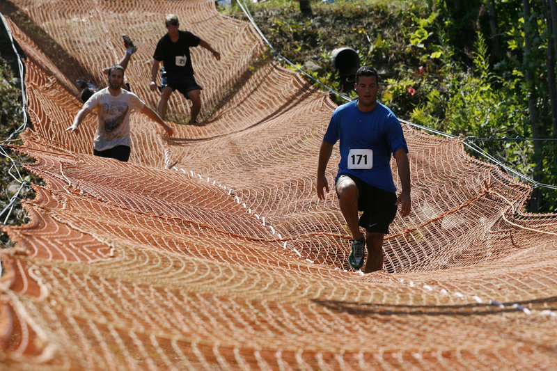 Competitors cross one of 16 obstacles in the Tough Mountain Challenge.