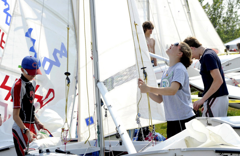Fourteen-year-old Toni Rerisi of Manchester, Mass., gets her 420 class sailboat ready to race.