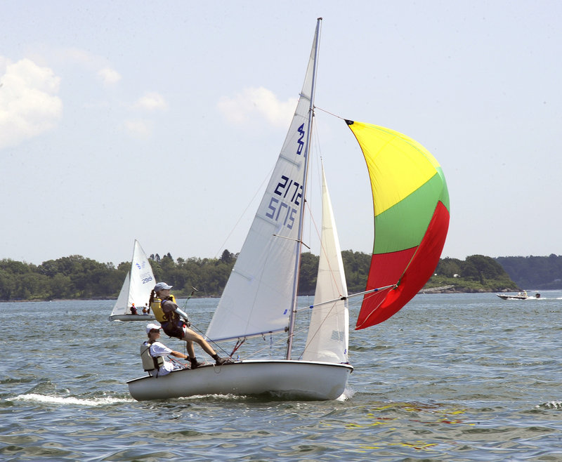 James Collins and Antonia Leggett maneuver their 420 class sailboat Tuesday during a USA Junior Olympics race in Portland. The event involves about 100 boats in three classes.
