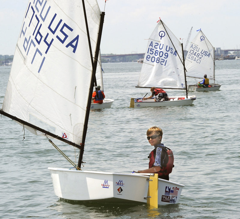 Caleb Robinson, 11, of Falmouth jockeys for position as he waits for the signal to start the Optimist class race Tuesday.