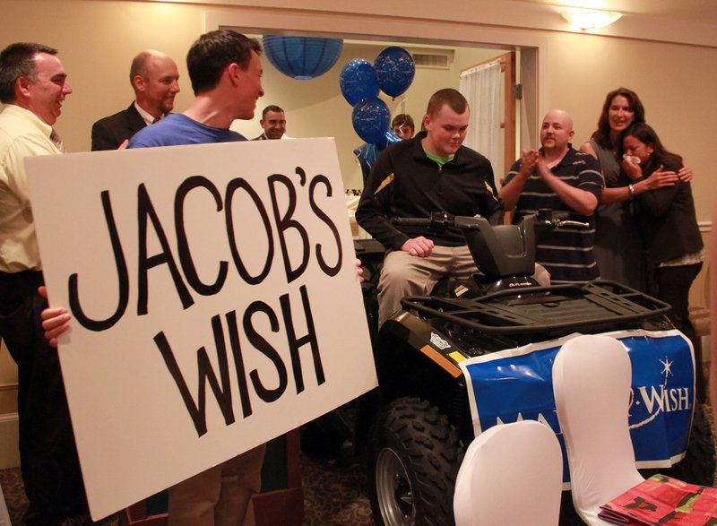 Jacob, a 16-year-old Kennebec County youth fighting cancer, was recently granted his wish for on ATV by the Make-a-Wish Foundation. Jacob is on the ATV and his mother is far right.