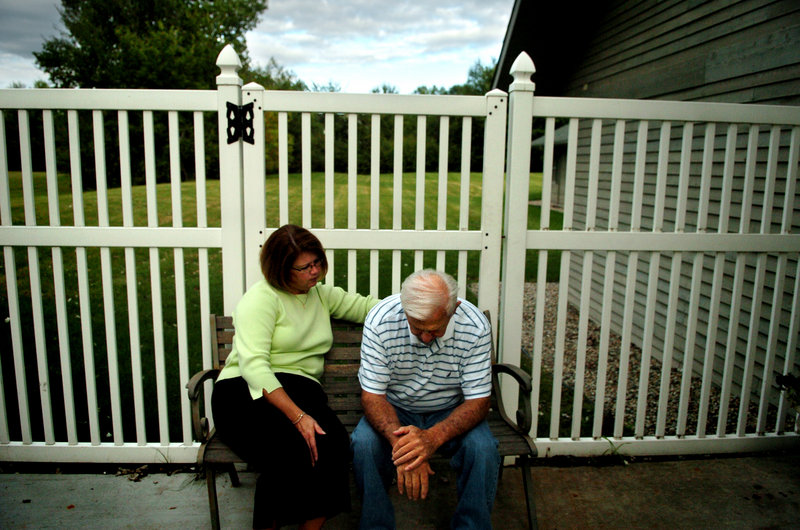 A woman visits with her father at the Nottingham Place senior living center in 2007 in Midland, Mich. Estimates are that half of people who meet medical criteria for dementia have not been diagnosed with it, and many who are told they have it don’t.
