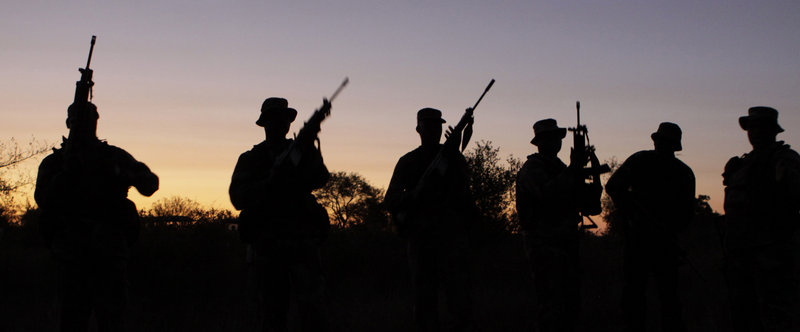 Armed soldiers stage a night patrol at an isolated outpost in South Africa’s Kruger National Park this week. Soldiers, park officials, judicial, customs and tax officers are coordinating a multi-pronged strategy to combat rhino poaching in the country’s flagship park. Poachers killed 333 rhino in South Africa last year, and will likely top 400 this year.