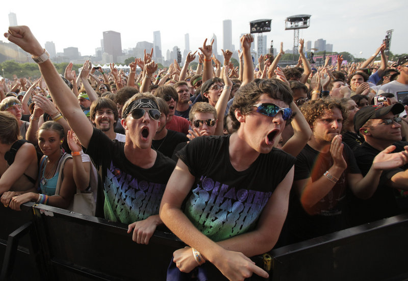 Fans watch Wolfmother’s performance at the Lollapalooza music festival in Chicago in August of last year. YouTube will live stream Lollapalooza and Austin City Limits this summer; in the past it has streamed other festivals, including Bonnaroo in Tennessee.