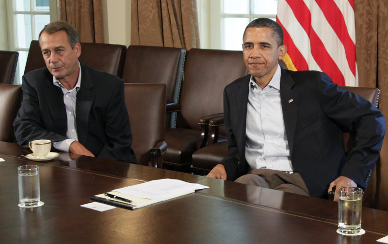 President Barack Obama and House Speaker John Boehner of Ohio, left, meet to discuss the debt deal – or lack of one – in the Cabinet Room of the White House on Saturday.