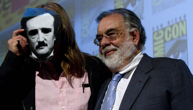 Francis Ford Coppola stands with Val Kilmer, who wears a 3-D mask in the image of Edgar Allen Poe.