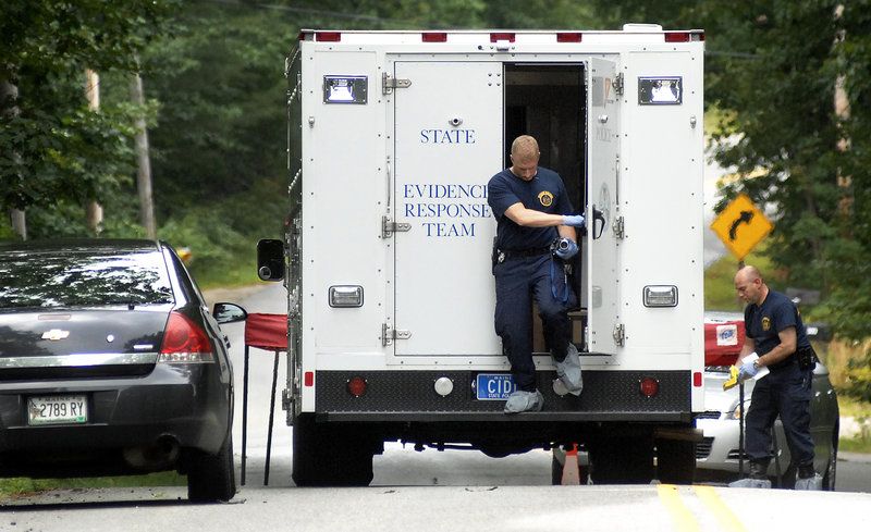 State police prepare to collect evidence Tuesday at the scene of Monday’s shooting of two people outside a mobile home in New Gloucester. Police said there was a history of domestic violence between the suspected shooter and Renee Sandora, who was killed.