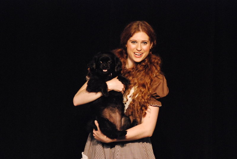 Brittany Morton portrays Dorothy and Daisy plays Toto in "The Wizard of Oz" at the Arundel Barn Playhouse.