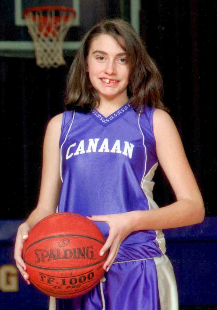 This 2010 photo shows Celina Cass of West Stewartstown, N.H., in a basketball team uniform in neighboring Canaan, Vt.