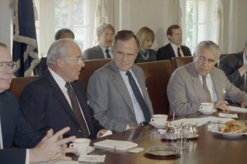 President George H.W. Bush, center, met with congressional budget leaders, including Reps. Bob Michel, R-Ill, left, and Benjamin Gilman, R-N.Y., at the White House in 1990. The country endured months of bickering and brinksmanship before Congress passed the biggest deficit-reduction packages in American history.