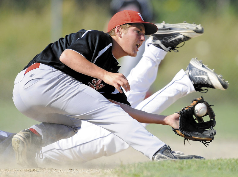 Bangor’s Seth Freudenberger dives in to second base, beating a tag by Jack Lano of Morrill Post during Bangor’s 11-4 win Thursday in the Legion state tournament.