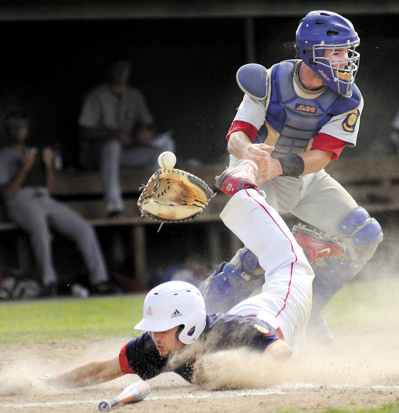 Gayton Post catcher Hyde McKee has the ball and glove knocked away Thursday as Ryan Edwards of Augusta barrels into the plate during Augusta's 21-11 win in the Legion tourney.