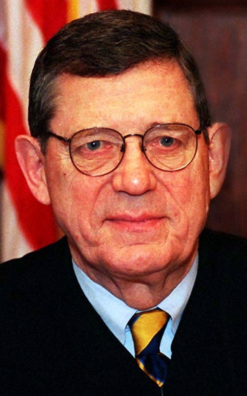 Justice Carl O. Bradford, presiding at hearing
