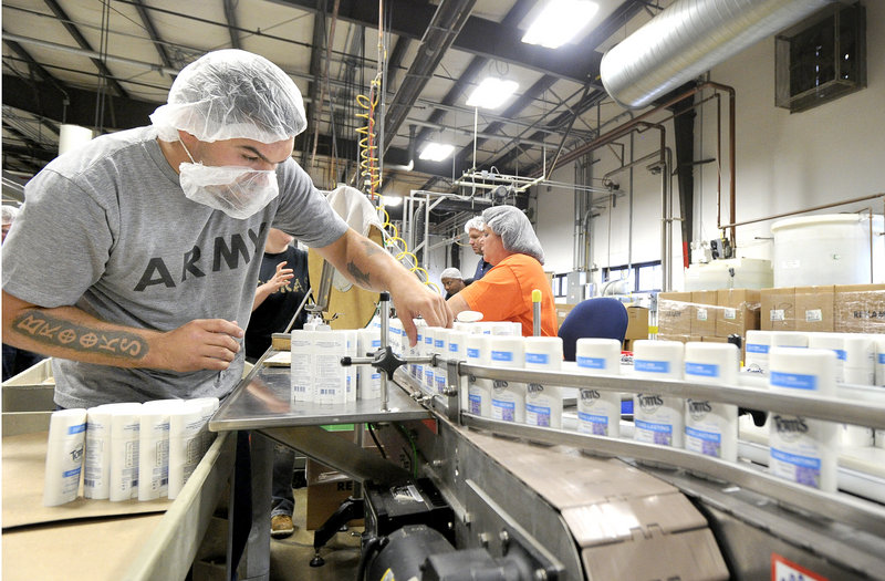Brooks Hobbs works on the deodorant line at Tom’s of Maine in Sanford. The company’s products are made from natural ingredients.