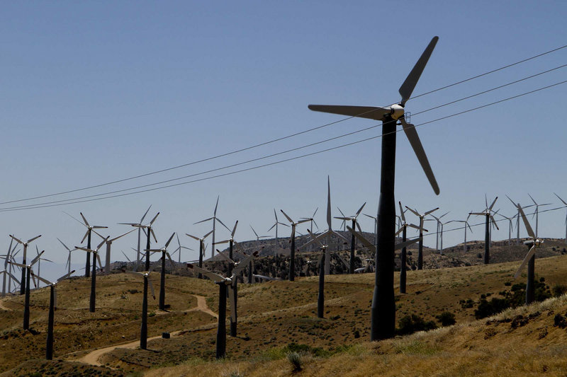 Wind turbines are seen in operation in the Tehachapi Pass near Tehachapi, Calif.