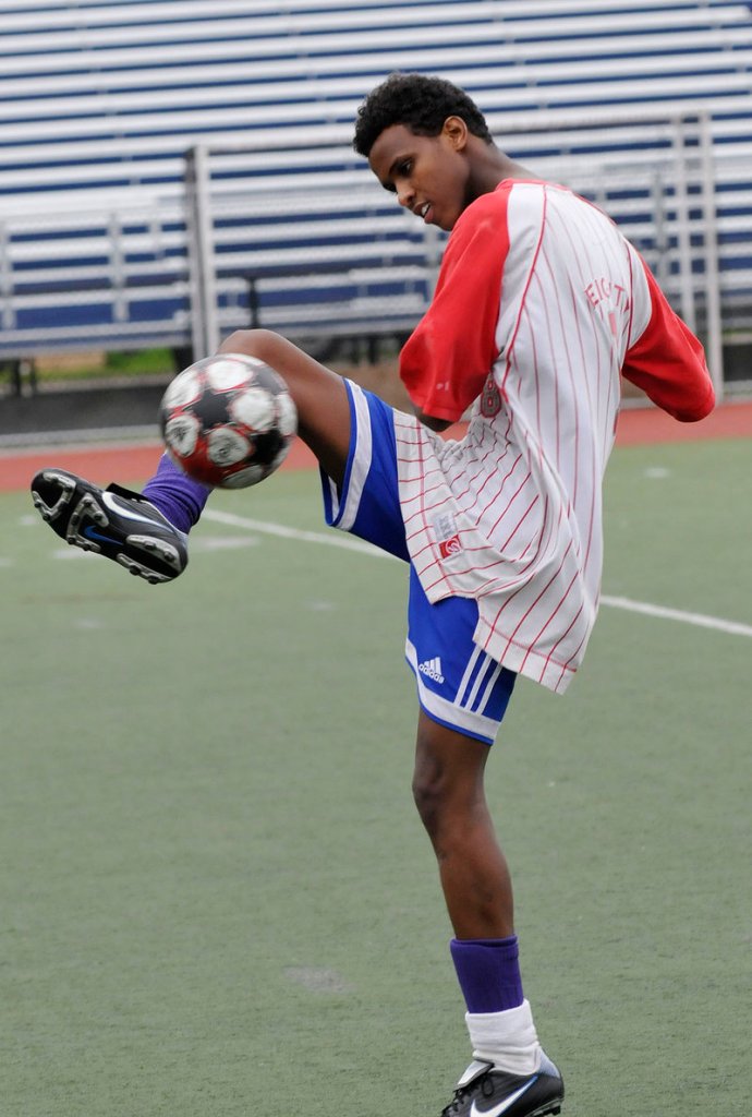 Sadam Sharit, 19, of Portland kicks the ball around before the games Friday.