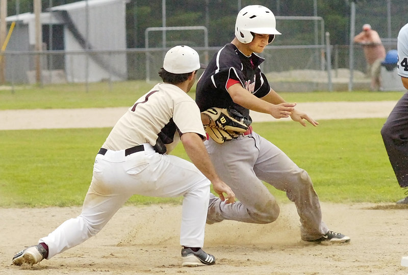 Third baseman Eric White of Brewer tags out Adam Helmke of Morrill Post, who was attempting to stretch a double into a triple during Brewer’s 8-3 victory Friday.