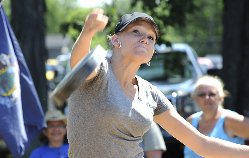 Angie Littlefield of Wells tosses a 3.5-pound skillet 60 feet in the annual women’s competition.