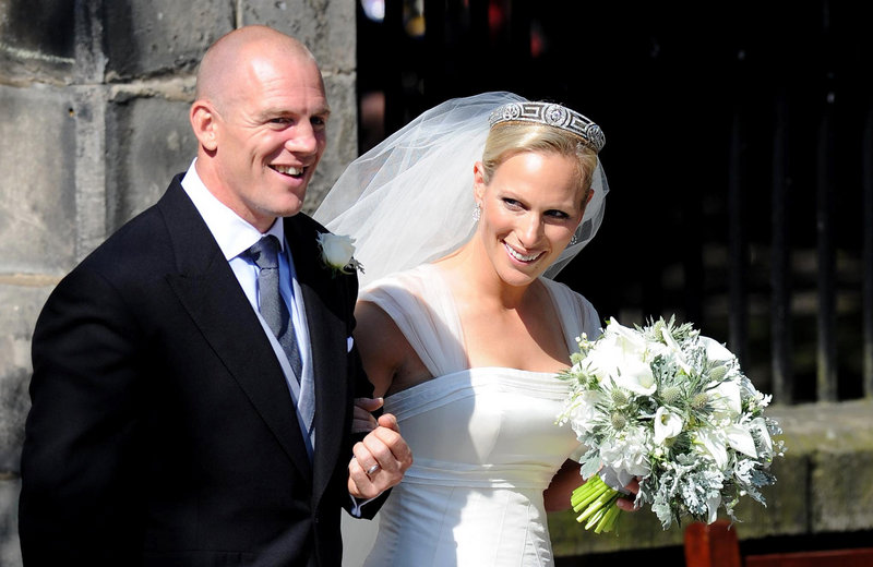 Rugby player Mike Tindall and Zara Phillips emerge from Canongate Kirk in Edinburgh after their wedding Saturday.