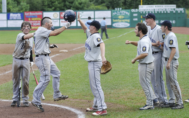 Pat Parker of Bedford Post celebrates with his teammates after hitting a home run Monday against Whitestown, N.Y., during the American Legion Northeast Regional final.
