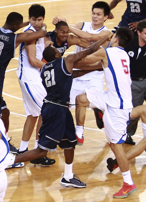Players of the Georgetown University men's basketball team and China's Bayi Rockets fight during their exhibition game in Beijing on Thursday. The bench-clearing brawl at the exhibition game between American and Chinese basketball teams marred the orchestrated harmony of U.S. Vice President Joe Biden's visit to China. The fight forced the game to end early.
