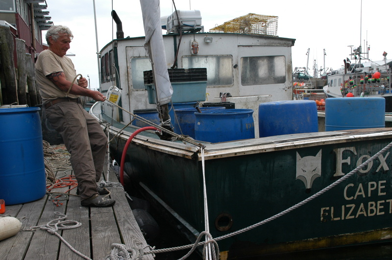 Anticipating high winds from Hurricane Irene, lobsterman Skip Werner ties fast his 40-foot lobster boat Foxie Lady to a dock on Union Wharf in Portland on Saturday. The storm was on track to hit Maine on Sunday.