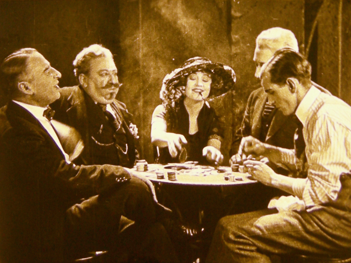 In this image released by the National Film Preservation Foundation, Betty Compson, center, is shown in a scene from "The White Shadow," thought to be the earliest surviving feature by Alfred Hitchcock.
