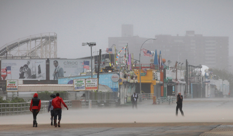 Driving wind and rain lash the Coney Island boardwalk in New York as Irene came closer to the area today. Irene hit Coney Island with 65-mph winds, making it now a tropical storm.