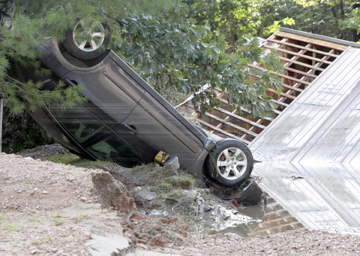 A car lies upside down today in the aftermath of Tropical Storm Irene in Waterbury, Vt.