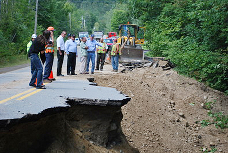 Gov. Paul LePage inspects flood damage in Rumford with Maine Emergency Management Agency Director Robert McAleer and Rumford officials.