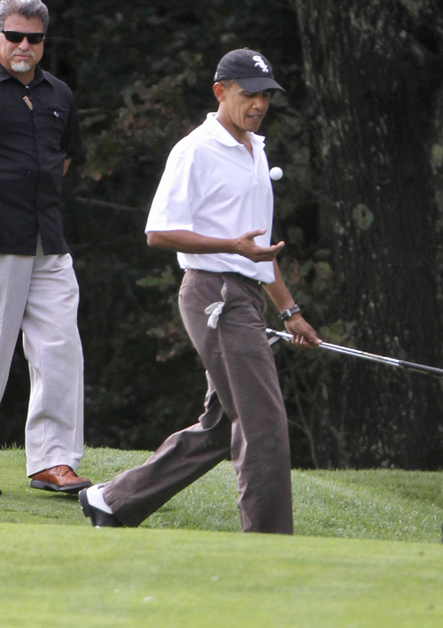 In this Aug. 25, 2010, photo, President Barack Obama plays golf at the Mink Meadows Golf Club, in Vineyard Haven, Mass., on the island of Martha's Vineyard. President Barack Obama will again vacation with his family in Martha's Vineyard at the end of this month.