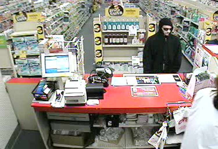 A security camera image of the man who robbed the CVS pharmacy at Pine Tree Shopping Center.