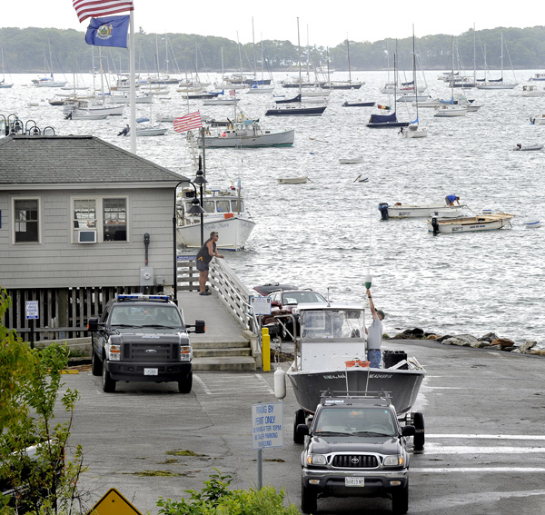 Boat owners start hauling their boats to safety today at the Falmouth Town Landing where hundreds of boats are moored and in danger of damage from Hurricane Irene, whose effects could be felt in Maine as early as Sunday.