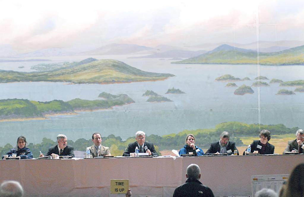 The Land Use Regulation Commission listens to a speaker during a public hearing on the proposed concept plan for Plum Creek's lands in the Moosehead Lake Region in 2007. A plan to eliminate the commission and give its work to county governments is far too drastic.