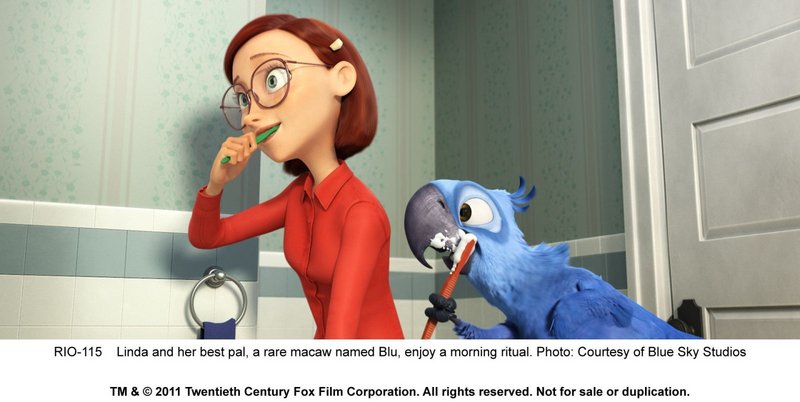 Linda (voiced by Leslie Mann) and her pal Blu (voiced by Jesse Eisenberg) enjoy a morning ritual in “Rio.”