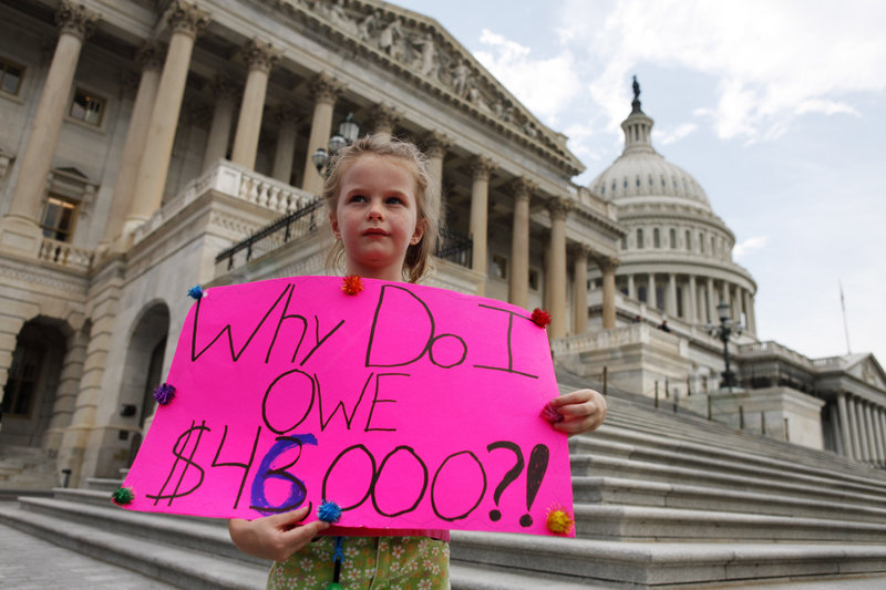 Holly Matthews, 7, of Kansas City, Mo., was on Capitol Hill with her family Monday to show her support for a balanced budget amendment just before the House voted to pass debt legislation. The next confrontation in Congress promises to be at least as contentious as the one just finished.