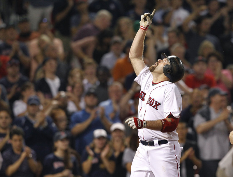Kevin Youkilis points after hitting a solo home run in the sixth inning of Boston’s 3-2 win over Cleveland on Tuesday. The home run tied the game 2-2, setting the stage for Boston’s dramatic ninth-inning victory.