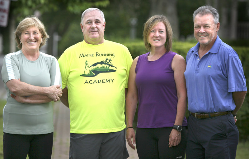 Susan Kimball, left, and Peter King, right, trained for the Beach to Beacon under a program that includes coaches Roger Morse, second left, and Kathy Bowe, second right.