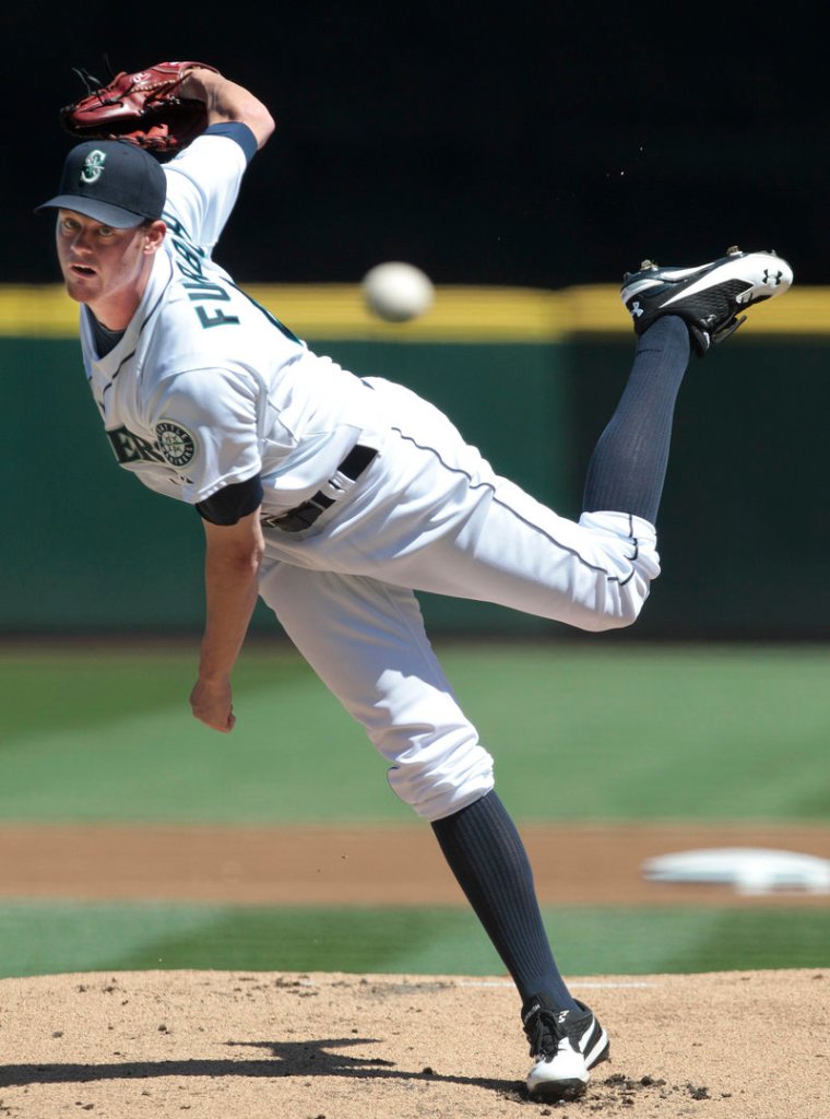 Charlie Furbush delivers a pitch Wednesday in his first start for Seattle since being traded from Detroit. Furbush allowed one run in five innings as the Mariners beat Oakland, 7-4.