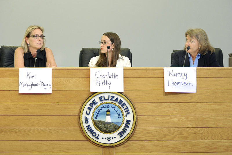 Cape Elizabeth High School senior Charlotte Rutty, center, asks questions submitted by attendees at a candidates forum Wednesday with Kimberly Monaghan-Derrig, left, and Nancy Thompson. They are running for the House District 121 seat.