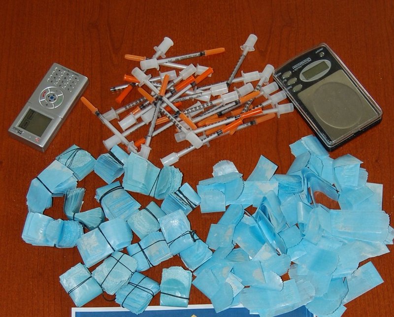 This image shows heroin packets and needles seized in a bust in the midcoast town of Warren on Wednesday night. Authorities estimated the street value at $19,000.