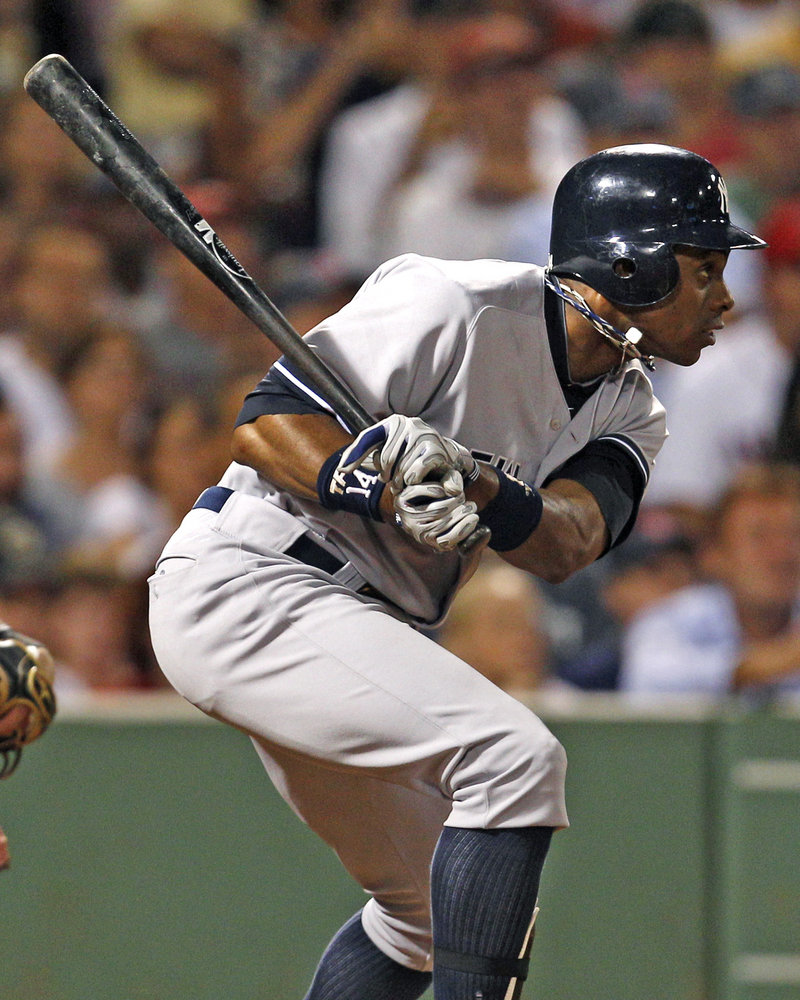 Curtis Granderson of the Yankees follows through with an RBI single in the sixth inning of the 3-2 victory Friday night against the Red Sox.