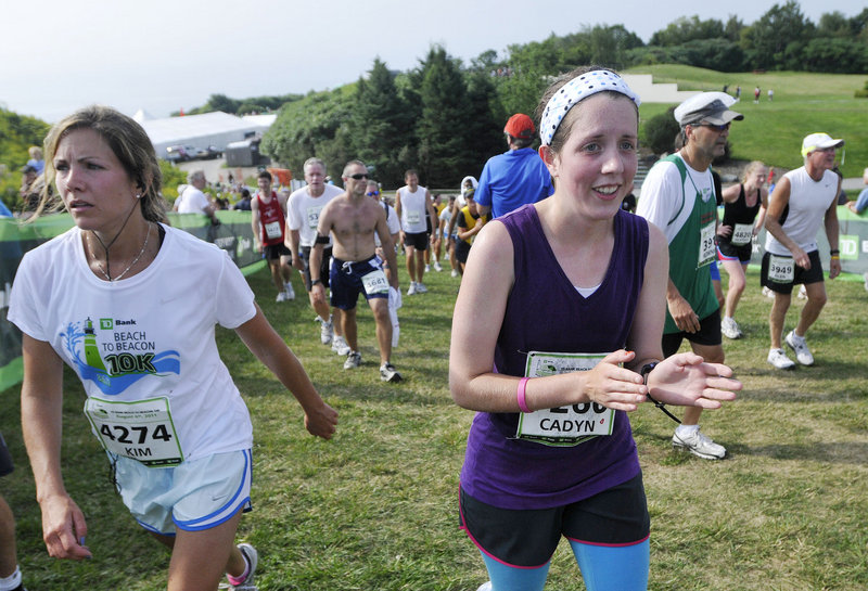 Eighteen-year-old Cadyn Wilson, right, of Hallowell walks from the finish line after her first Beach to Beacon race. Wilson hadn't seen the course before running and was shocked when the final hill appeared. "I said, 'wait a second, what's this?' I thought this was the finish!"