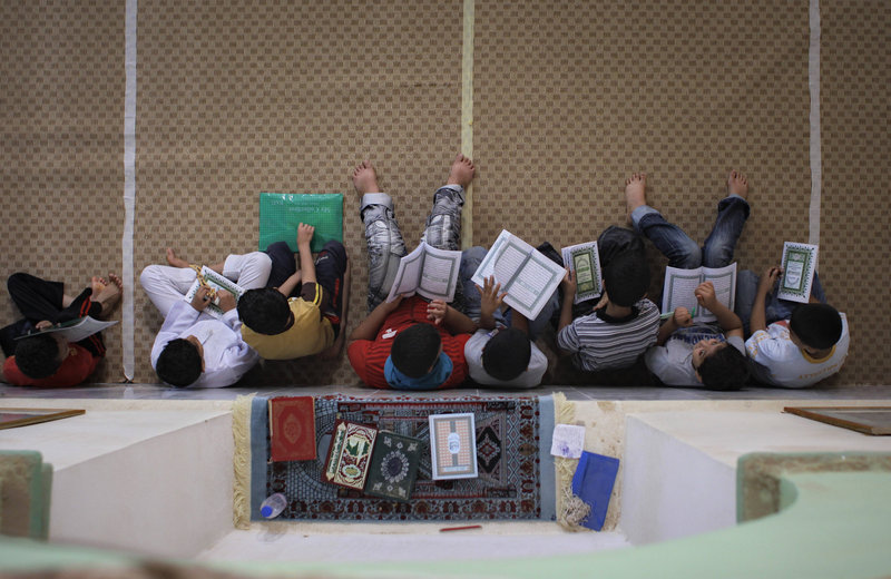 Libyan children study the Quran inside a mosque during the Muslim holy month of Ramadan in the rebel-held town of Benghazi, Libya, on Saturday. Rebels opened a new front Saturday and hope to fight their way to the capital, Tripoli.