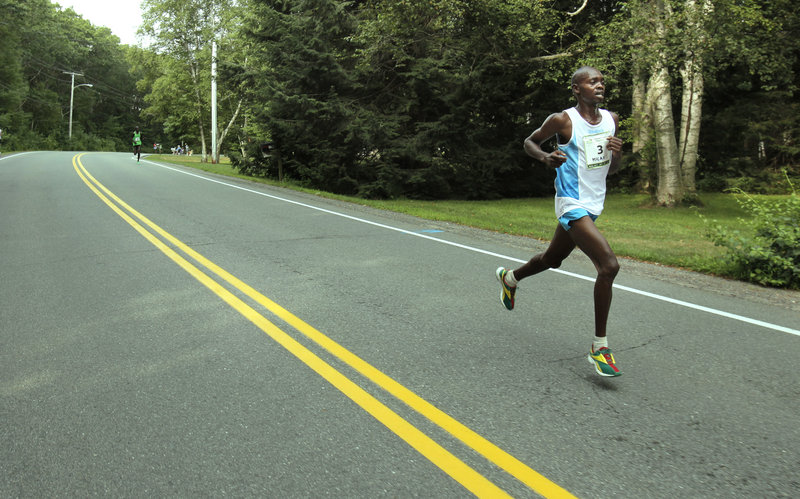 Gregory Rec/Staff Photographer Micah Kogo was on his own by Mile 4 of the Beach to Beacon 10K, having opened up a comfortable lead on fellow Kenyan Lucas Rotich. Kogo finished in 27 minutes, 46.9 seconds, becoming the 11th Kenyan champion in the races 14-year history.