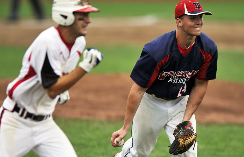 Whitestown pitcher Daniel Smith prepares to flip the ball to first base to retire a Norwalk batter. Whitestown will play Bedford, N.H., in today's championship round.